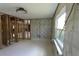 Large windows bring plenty of natural light to this open-concept living room at 129 Pierson Ln, Sarasota, FL 34242