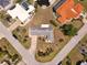 Aerial view shows a house with a driveway on a well-manicured lot at 135 Gulfview Rd, Punta Gorda, FL 33950