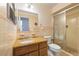 Bathroom featuring tiled walls, vanity with granite countertop, and a shower at 135 Gulfview Rd, Punta Gorda, FL 33950