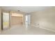 Spacious bedroom with closet and an adjacent full bathroom and entry to another room at 135 Gulfview Rd, Punta Gorda, FL 33950