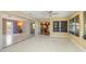 Open sunroom with tile floors provides access to the kitchen and offers beautiful views of the outdoors at 135 Gulfview Rd, Punta Gorda, FL 33950