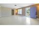 Spacious living room with neutral paint, smooth floors, and a large window providing ample natural light at 135 Gulfview Rd, Punta Gorda, FL 33950