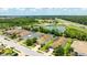 Scenic aerial view of homes near a tranquil pond and lush green landscape at 13819 American Prairie Pl, Bradenton, FL 34211