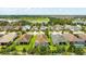 An aerial view displays a neighborhood with green spaces, ponds, and well-maintained lawns at 13819 American Prairie Pl, Bradenton, FL 34211