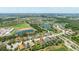 Aerial view of a residential community with ponds and lush landscaping at 13819 American Prairie Pl, Bradenton, FL 34211