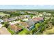 An aerial view showcases a residential neighborhood with well-maintained homes and green spaces at 13819 American Prairie Pl, Bradenton, FL 34211