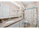 Well-lit bathroom with double sinks, spacious vanity, and tub shower at 13819 American Prairie Pl, Bradenton, FL 34211