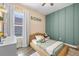 Comfortable bedroom with modern décor, soft neutral tones, plush bed, and natural light at 13819 American Prairie Pl, Bradenton, FL 34211