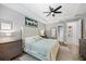 Large main bedroom with tray ceiling, ceiling fan and ensuite bathroom at 13819 American Prairie Pl, Bradenton, FL 34211