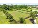 A fenced-in dog park provides a secure area for pets to roam, with a water feature and benches for their humans at 13819 American Prairie Pl, Bradenton, FL 34211