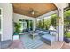 Inviting covered lanai featuring a brick floor, wood ceiling and comfortable wicker seating at 13819 American Prairie Pl, Bradenton, FL 34211