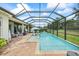 Backyard pool and covered patio area perfect for entertaining guests and enjoying the Florida lifestyle at 13819 American Prairie Pl, Bradenton, FL 34211