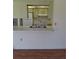 Kitchen with light green cabinets, stainless steel sink and white appliances at 1509 Overbrook Rd, Englewood, FL 34223