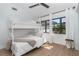 Bright bedroom with a bunk bed, wood floors, and an outside view at 16 Leeward Dr, Placida, FL 33946