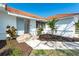 Exterior of home featuring tile roof, gray door, and landscaping at 16 Leeward Dr, Placida, FL 33946