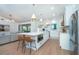 Open-concept kitchen featuring a central island with a built-in microwave and seamless flow to the living area at 16 Leeward Dr, Placida, FL 33946