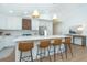Spacious white kitchen featuring a large center island with seating and modern stainless-steel appliances at 16 Leeward Dr, Placida, FL 33946