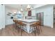 Bright kitchen features a large island with seating, modern appliances, and stylish pendant lighting at 16 Leeward Dr, Placida, FL 33946
