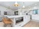 Island in the kitchen features a stainless-steel microwave in the middle and modern fixtures at 16 Leeward Dr, Placida, FL 33946