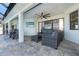Covered lanai area with outdoor seating and TV at 16 Leeward Dr, Placida, FL 33946