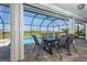 Screened in lanai with pool and golf course views at 16 Leeward Dr, Placida, FL 33946