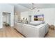 Living room with a large sectional couch, a TV and doors to a patio with a golf course view at 16 Leeward Dr, Placida, FL 33946