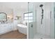 Elegant bathroom with double vanity, freestanding tub, glass shower, and modern fixtures at 16 Leeward Dr, Placida, FL 33946