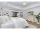 Bright and airy main bedroom with ample natural light and hardwood floors at 16 Leeward Dr, Placida, FL 33946