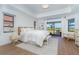 Bright and airy main bedroom with ample natural light and hardwood floors at 16 Leeward Dr, Placida, FL 33946