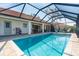 Covered pool area with pavers and view of the patio at 16 Leeward Dr, Placida, FL 33946