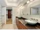 Modern bathroom featuring double vanity sinks and a glass walk-in shower at 1610 S Orange Ave, Sarasota, FL 34239