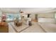 Bright living room featuring tile flooring and sliding glass doors with views of the pool at 1610 S Orange Ave, Sarasota, FL 34239