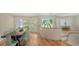 Open concept living space featuring tile flooring, large windows, and decorative front doors at 1610 S Orange Ave, Sarasota, FL 34239