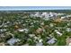Spacious neighborhood featuring lush tree coverage, commercial buildings, single Gathering homes, and inviting streets at 1677 Hyde Park St, Sarasota, FL 34239