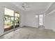 Light-filled bedroom with large windows offering scenic views and a refreshing atmosphere at 1677 Hyde Park St, Sarasota, FL 34239
