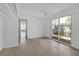 Inviting bedroom with a ceiling fan and sliding glass doors to connect the outdoors with the in at 1677 Hyde Park St, Sarasota, FL 34239