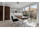 An elegant dining area with natural light and contemporary decor, creating an inviting and stylish space at 1677 Hyde Park St, Sarasota, FL 34239