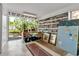 Creative home office with built-in bookshelves, a workspace overlooking the garden, and ample storage at 1677 Hyde Park St, Sarasota, FL 34239