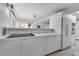 Clean kitchen with a cooktop and views that create a light-filled and practical cooking space at 1677 Hyde Park St, Sarasota, FL 34239