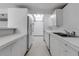 Bright kitchen featuring modern appliances, white countertops, and ample storage, blending style with functionality at 1677 Hyde Park St, Sarasota, FL 34239