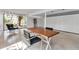 Open concept living room featuring modern decor and large windows, providing natural light and a spacious feel at 1677 Hyde Park St, Sarasota, FL 34239
