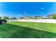 Large, well-maintained backyard with lush green grass and a pristine white fence offering privacy at 1721 Palm Warbler Ln, Ruskin, FL 33570