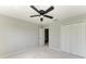 This is a bedroom with neutral walls, a ceiling fan, a closet, and carpet flooring at 1721 Palm Warbler Ln, Ruskin, FL 33570