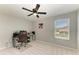 Bedroom with a ceiling fan, carpet floors, and desk at 1721 Palm Warbler Ln, Ruskin, FL 33570