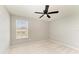 Neutral bedroom with carpet floors, a ceiling fan, and a window at 1721 Palm Warbler Ln, Ruskin, FL 33570