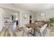 Beautiful dining room with wood table, accent wall art, and hardwood style floors at 1721 Palm Warbler Ln, Ruskin, FL 33570