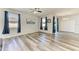 Bright dining room features wood-look floors, natural light, and sliding door access to the yard at 1721 Palm Warbler Ln, Ruskin, FL 33570