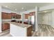 Kitchen featuring stainless steel appliances, granite countertops, and hardwood style floors at 1721 Palm Warbler Ln, Ruskin, FL 33570