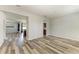 Spacious living room featuring modern flooring and an open layout, perfect for entertaining at 1721 Palm Warbler Ln, Ruskin, FL 33570