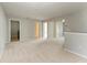 Large carpeted loft area boasts multiple doorways at 1721 Palm Warbler Ln, Ruskin, FL 33570